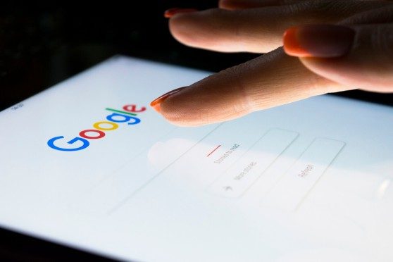person searching keywords on google